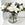 Bouquet of roses with roselily and limonium in a glass vase .