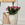 Big flower bouquet of pink and lilac roses in a sandstone vase